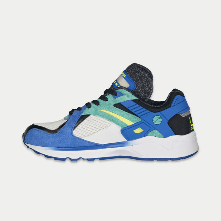 Multicolored sneaker with blue, green design on a light gray background